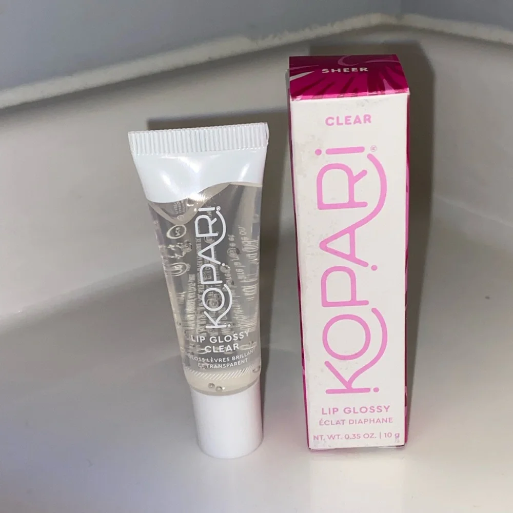 NWT KOPARI MOISTURIZING LIP GLOSSY WITH SHEA BUTTER AND COCONUT OIL
